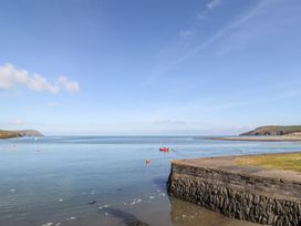 A view of water with a boat at Ty Fferm in Newport