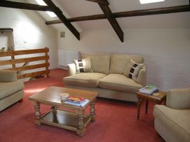 A living room with a sofa and coffee table at Ty Cariad in Newport