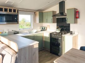 A kitchen with appliances at Morwenna in Hayle
