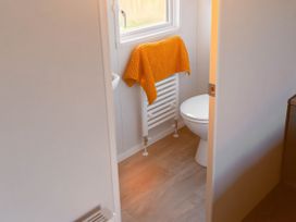 A bathroom with a toilet and radiator at Morwenna in Hayle