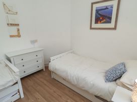 A bedroom with two beds and a drawer unit at Braeburn in Bamburgh