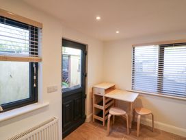 A room with a table and chairs at Duck Cottage
