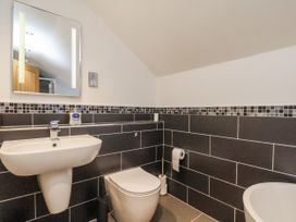 A bathroom with a sink and toilet at Chestnut Barn Aislaby near Whitby