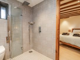 A bathroom with a shower and toilet at Chestnut Barn Aislaby near Whitby