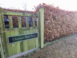 A gate leading to a patio area at Chestnut Barn in Aislaby near Whitby