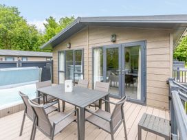 An outdoor dining area with a table and chairs at Wensleydale (Pet) Aysgarth