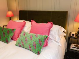 A bedroom with a bed and pillows at Fairview in Darsham
