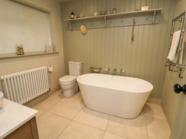 A bathroom with a bathtub and toilet at Fairview in Darsham