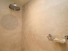 A shower with a shower head and a soap dish at Fairview in Darsham