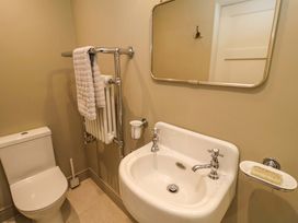 A bathroom with a toilet and sink at Fairview in Darsham