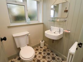 A bathroom with a toilet and sink at Fairview in Darsham