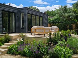 An outdoor area with seating on a deck at Fairview in Darsham