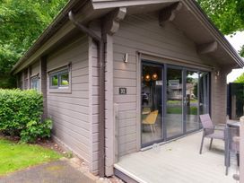 A house with a deck and chairs at Middleham Leyburn