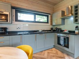 A kitchen with appliances and cabinetry at Middleham (Pet) Leyburn