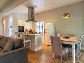 A kitchen with a table and chairs at Bainbridge in Leyburn