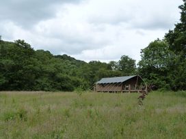A tent structure in a grassy area at Aeron in Newcastle Emlyn