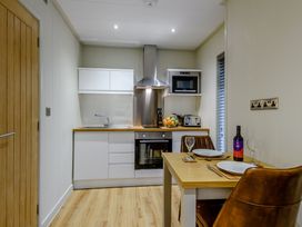A kitchen with modern appliances at Tennyson Spa Louth