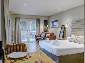 A studio with a bed and seating area at Tennyson Spa (Pet) in Louth