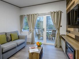 A living room with a sofa and coffee table at Anderby Spa (Pet) in Louth