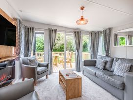 A living room with a sofa and television at Caistor Spa in Louth
