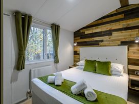 A bedroom with a bed and window at Alford Spa in Louth