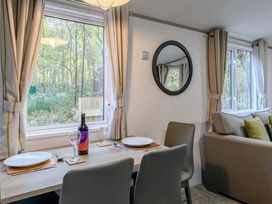 A dining area with a table and chairs at Alford Spa Louth