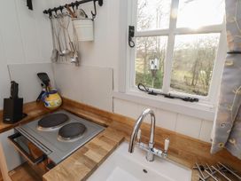 A kitchen with a sink and stove at Meadows in Hexham