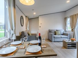 A dining room with a table set for a meal at The Kinder Spa (Pet) Louth