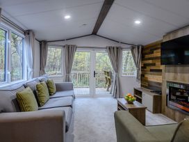 A living room with a sofa and television at Alford Spa (Pet) in Louth