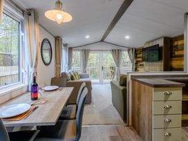 A living room with a dining area and a view to the outside at Alford Spa (Pet) Louth