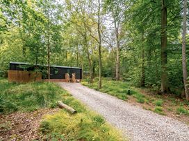 A cabin in a woodland area at Horncastle Plus (Pet) Louth