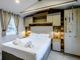 A bedroom with a double bed and shelves at Alford WF in Louth