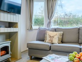 A living room with a sofa and television at Alford WF in Louth