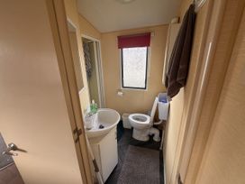 A bathroom with a sink and toilet at 29 Laburnham Court, Fleetwood