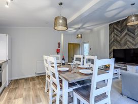 A dining room with a table and chairs at Stamford Spa in Louth