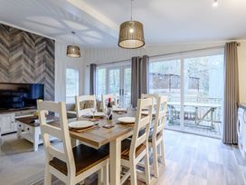 A dining room with a table and chairs at Stamford Spa (Pet) Louth
