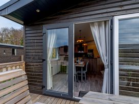 A dining area with a sliding door and table visible at Elsham Lodge (Pet) Louth