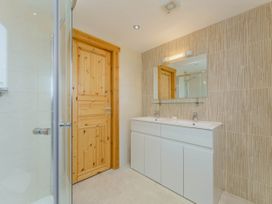 A bathroom featuring a shower and a vanity unit at Hazel Lodge in Louth