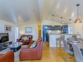 A living room with a sofa and coffee table at Retreat Lodge 4 in Louth