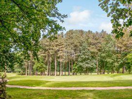 A golf course with trees and grass at Brayford Lodge Spa in Louth