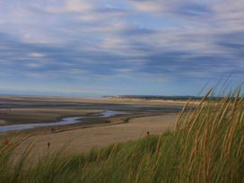 A beach with sand and people at Brayford Lodge Spa in Louth