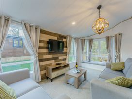 A living room with a sofa and coffee table at Brayford Lodge Spa (Pet) in Louth