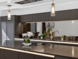A kitchen with a countertop and sink at Heddfan in Carmarthen
