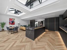 A kitchen with dining area and skylight at Ty Uchel