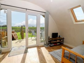 A living room with a view of the outdoors at Grape Escape near Halesworth