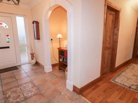 A hallway with a door and window at Bungalow Falcarragh in Falcarragh, County Donegal