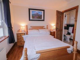 A bedroom with a bed and bedside table at Bungalow Falcarragh, Falcarragh, County Donegal