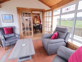 A living room with a sofa and coffee table at Bungalow Falcarragh in Falcarragh, County Donegal