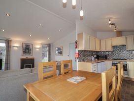 A dining room with a table and chairs at Colonsay