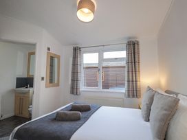 A bedroom with a bed and window at Colonsay